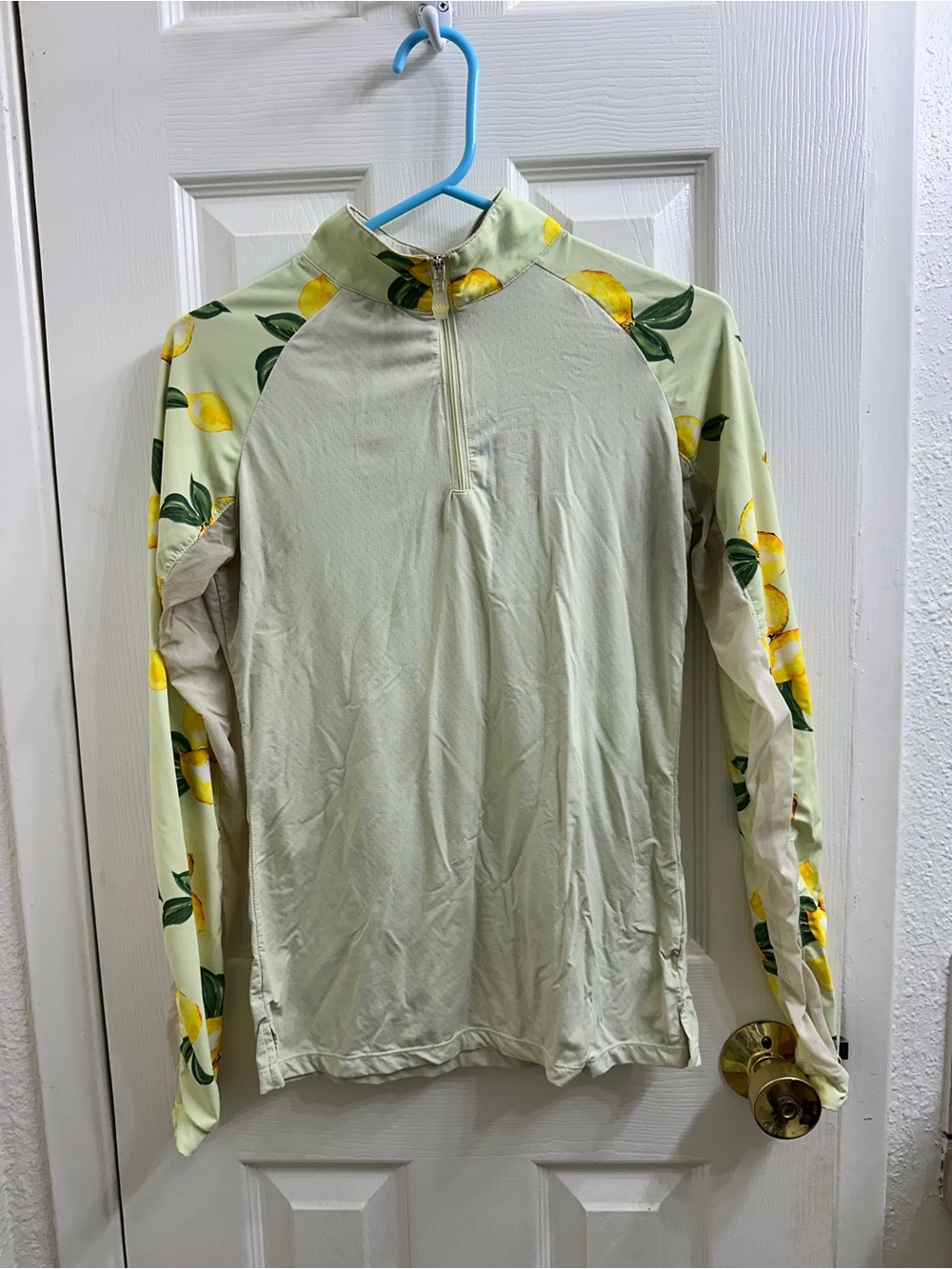 Kastel sun shirt 1/4 zip. Lemons on the sleeves. Size small.